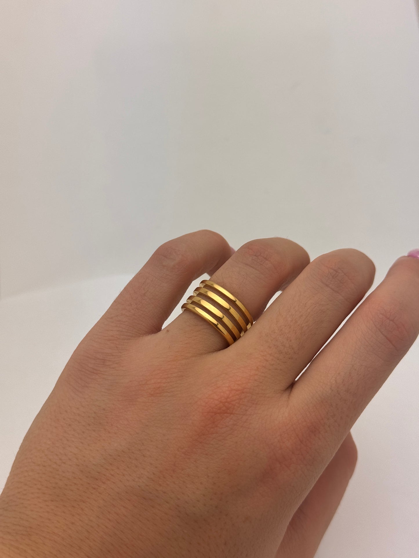 Stainless steel spiral ring in gold finish close-up shot