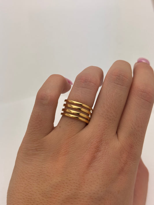 Gold spiral ring on hand, made from stainless steel with PVD plating, size 6